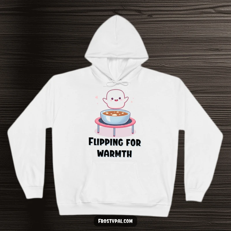 Funny hoodie depicting a marshmallow blob launching from a trampoline into hot cocoa, designed for warmth and sweet, humorous moments.