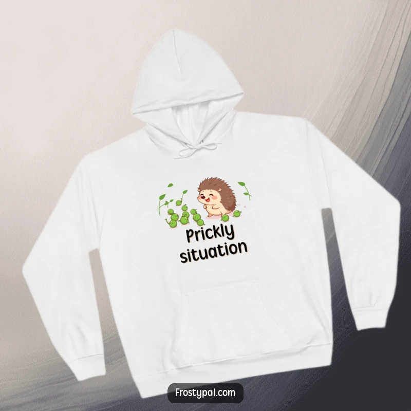 Funny hoodie featuring a giggling hedgehog trying to gather runaway peas, a warm and humorous depiction.