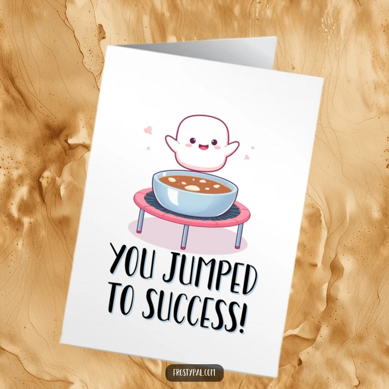 Funny Free Printable Congrats Card: A marshmallow blob launching from a trampoline into a hot cocoa bowl, celebrating achievement.